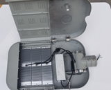 Medal panel for streetlight casing; module panel housing